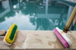 Old Two Plastic Brush On Poolside Stock Photo