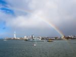 Hms Albion Being Towed Into Portsmouth Harbour Stock Photo