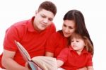 Family Reading Book Stock Photo