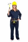 Smiling Constrution Worker Displaying Hammer Stock Photo