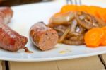 Beef Sausages Cooked On Iron Skillet Stock Photo