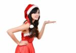 Santa Women Presenting Something On  Hand Stock Photo