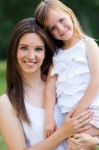 Mother And Daughter Having Fun Outdoors Stock Photo