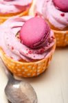 Pink Berry Cream Cupcake With Macaroon On Top Stock Photo