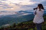 Women Are Shooting Sunrise Stock Photo