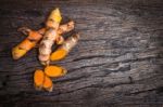 Turmeric Root On Wooden Plate With Copy Space For Text Stock Photo