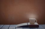 Cup And Book On Wooden Stock Photo