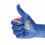 Flag Of The Cayman Islands On Thumb Up Hand Stock Photo