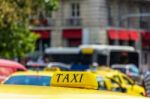 Yellow Taxi Sign On Cab Vehicle Roof Stock Photo