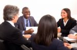 Multi Ethnic Team During Meeting Stock Photo