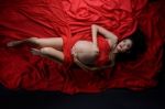 Glamour And Style Of Beautiful Young Asian Pregnant Woman Laying Stock Photo