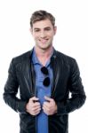 Fashion Man In Leather Jacket And Glasses Stock Photo