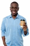 Young Man Holding Beverage Cup Stock Photo