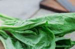 Leaves Of Kale On Wooden Stock Photo