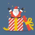 Santa Claus Out Of Big Gift Box Stock Photo