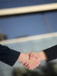 Handshaking Business People Stock Photo