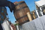 Scottish Man Pouring Rum From Cask Stock Photo