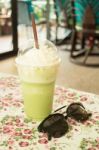 Glass Of Green Tea Latte Frappe Stock Photo