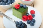 Green Tea Matcha Mousse Cake With Berries Stock Photo