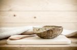 Brown Bowl With Spoon On Wooden Background Stock Photo