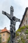 Statue Of Christ On A Wooden Cross In Krumlov Stock Photo