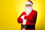 Saint Nick Posing Confidently Against Yellow Background Stock Photo