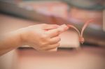 Hand Holding A Lace Stock Photo