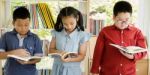 Asian Group Of Kids Study Read Book Together Stock Photo