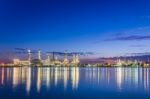 Twilight At Petroleum Refinery Along The River Stock Photo