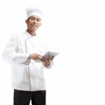 Chef Using Digital Tablet Stock Photo