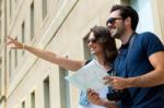 Young Tourist Couple Use Their Map And Pointing Where They Want Stock Photo