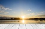 Wood Table Top On Blur Sunrise Background/ Use For Montage On Product Display Stock Photo