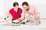 Family Makes Pancakes In The Kitchen Stock Photo