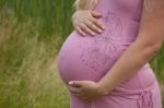 Pregnant Woman Holding Belly Stock Photo