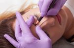 A Woman Getting Permanent Make Up Stock Photo