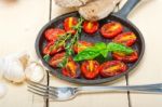 Baked Cherry Tomatoes With Basil And Thyme Stock Photo