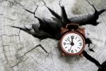 Red Clock On Old Cut Wooden Stock Photo