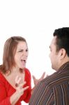 Young Couple In Conflict Shouting Isolated On White Background Stock Photo