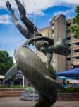 David Wayne Sculpture Girl With The Dolphin Next To Tower Bridge Stock Photo