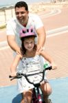 Girl Riding bicycle Stock Photo