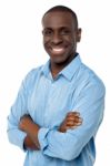 Casual African Man With Arms Crossed Stock Photo