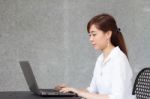 Portrait Of Thai Adult Businesswoman Beautiful Girl Using Computer Notebook Stock Photo