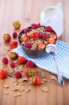 Bran Flakes With Fresh Raspberries And Strawberries And Pitcher Stock Photo