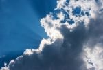 Sun's Rays Behind The Cloud Stock Photo