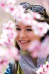 Beautiful Young Woman With Flowers In The Field Stock Photo