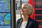 Smiling Business Woman Looking Up Stock Photo