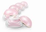 Several Pink Dome Cosmetic Jar On White Background Stock Photo