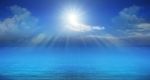 Blue Sky Sun Beam Over Sea Stock Photo