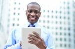 Handsome Man Using His Tablet Computer Stock Photo