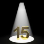 Golden Number 15 With Spotlit Stock Photo